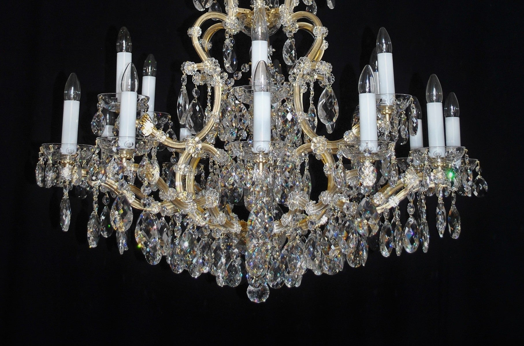 Crystal chandelier with candles on a black background