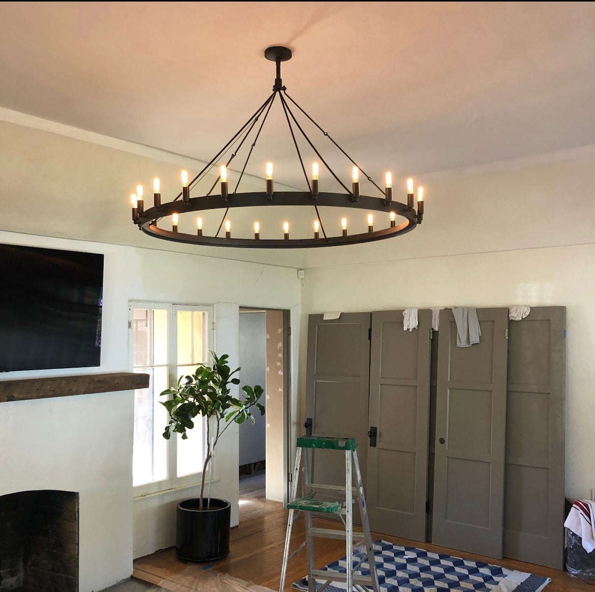 Elaris 50 Inch Tubular Candle Wagon Wheel Chandelier