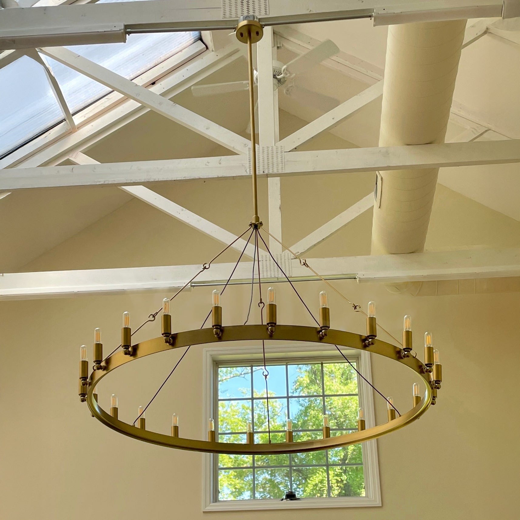 Elaris 50 Inch Tubular Candle Wagon Wheel Chandelier