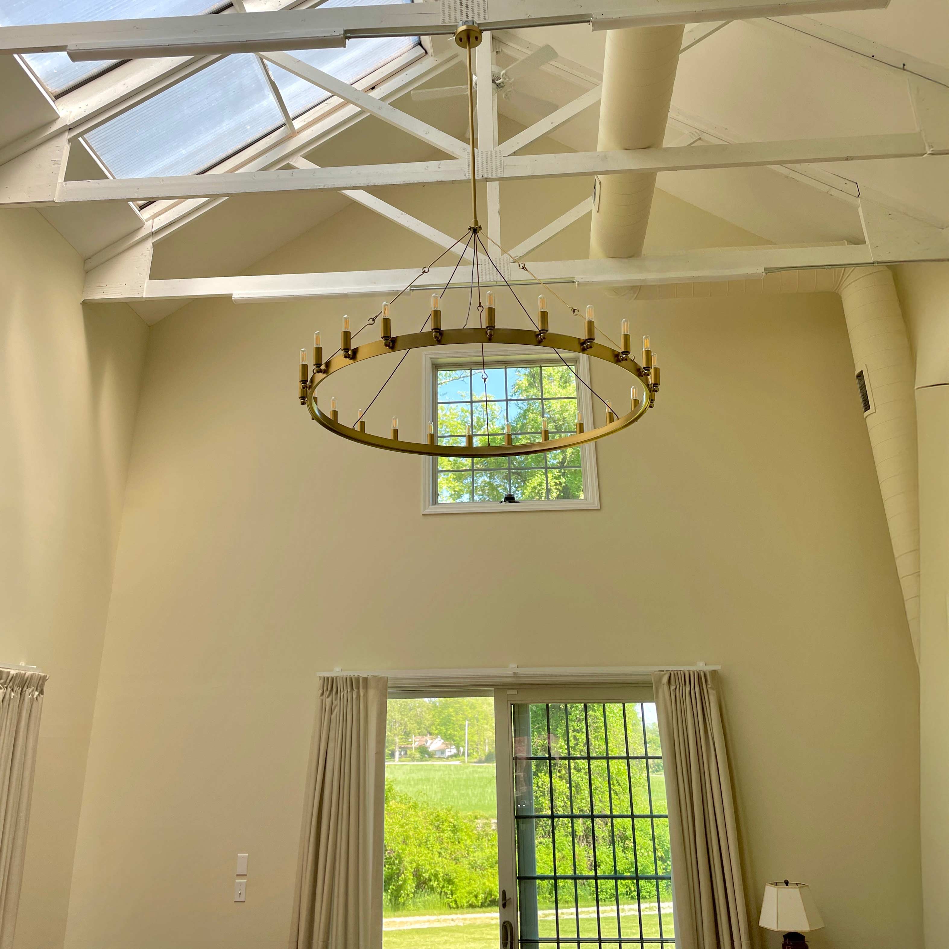 Elaris 50 Inch Tubular Candle Wagon Wheel Chandelier
