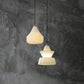 Alabaster Hat Pendant Light Over Nightstand