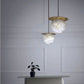 Alabaster Sphere Pendant Light Above Bed