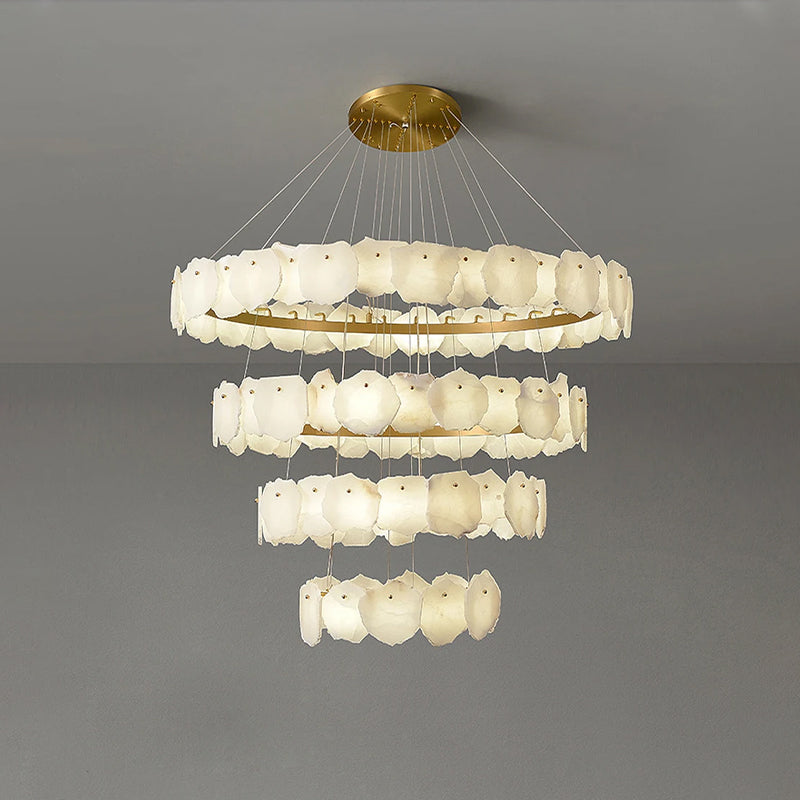 Chandelier with multiple tiers of round lights on a gray background